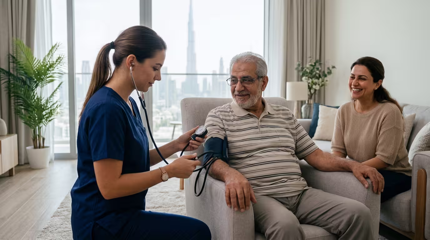 Home care services in Dubai, showing a caregiver assisting an elderly man at home.