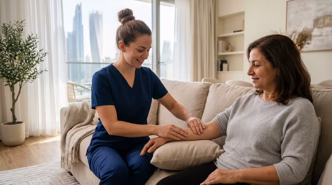 Lymphatic Physiotherapy at Home in Dubai: Post-Surgery and Lymphedema Care Without Hospital Visits 14 Lymphatic physiotherapy session with a physiotherapist assisting a female patient during treatment.